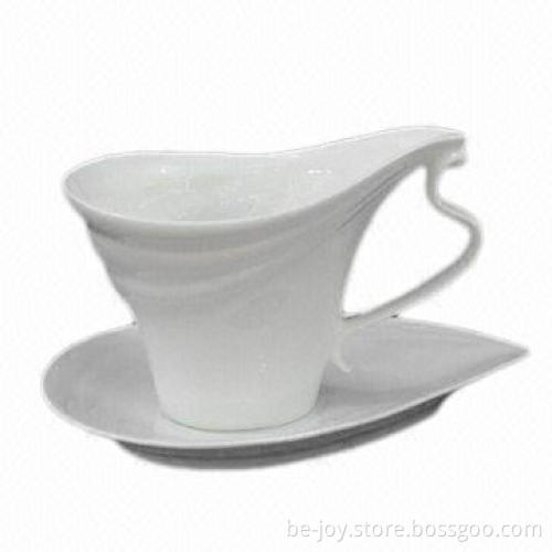 New bone cup and saucer with spoon
